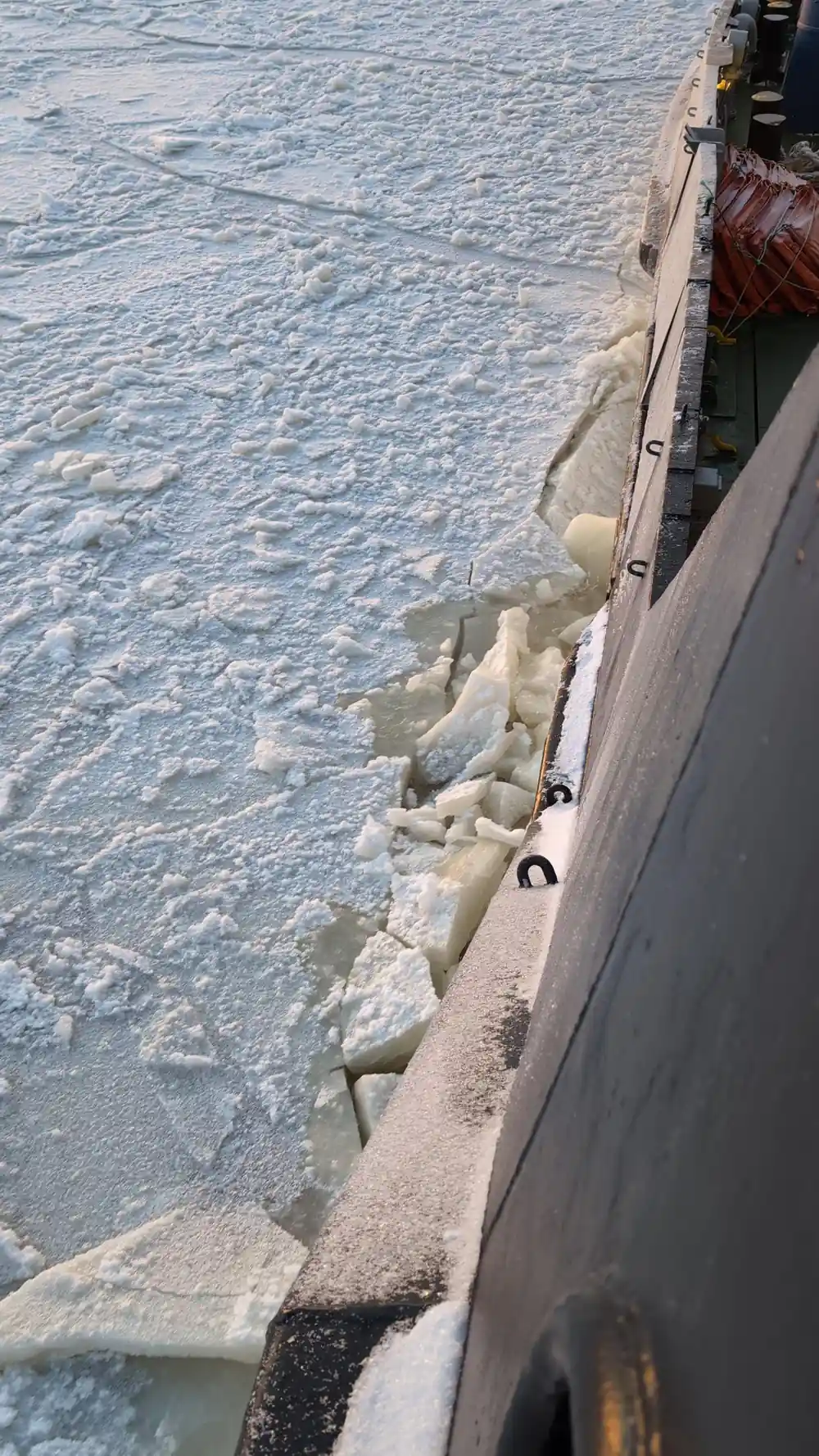 Broken ice pressed against the hull plating