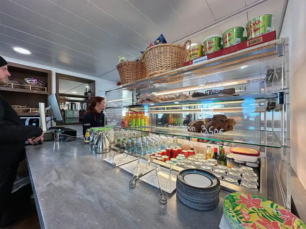 The ship cafe counter with drinks, pastries and plates