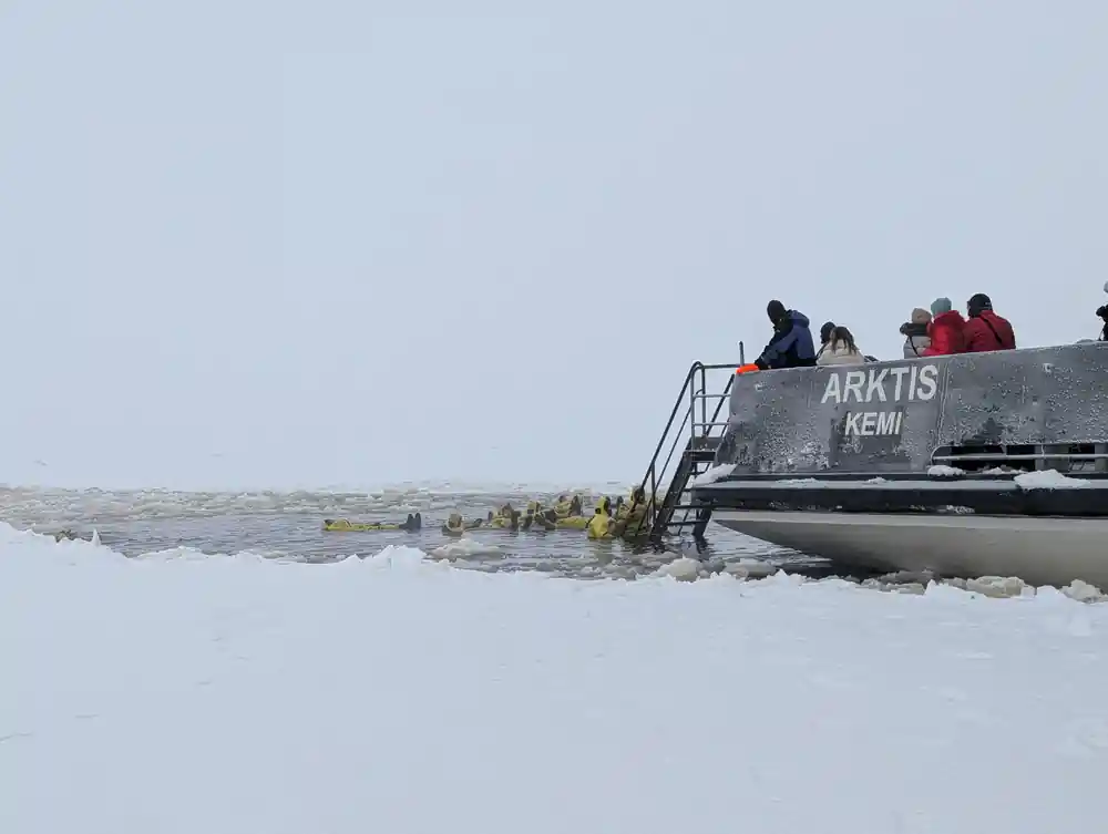 The stern of Arktis lettered Kemi with people on the ice