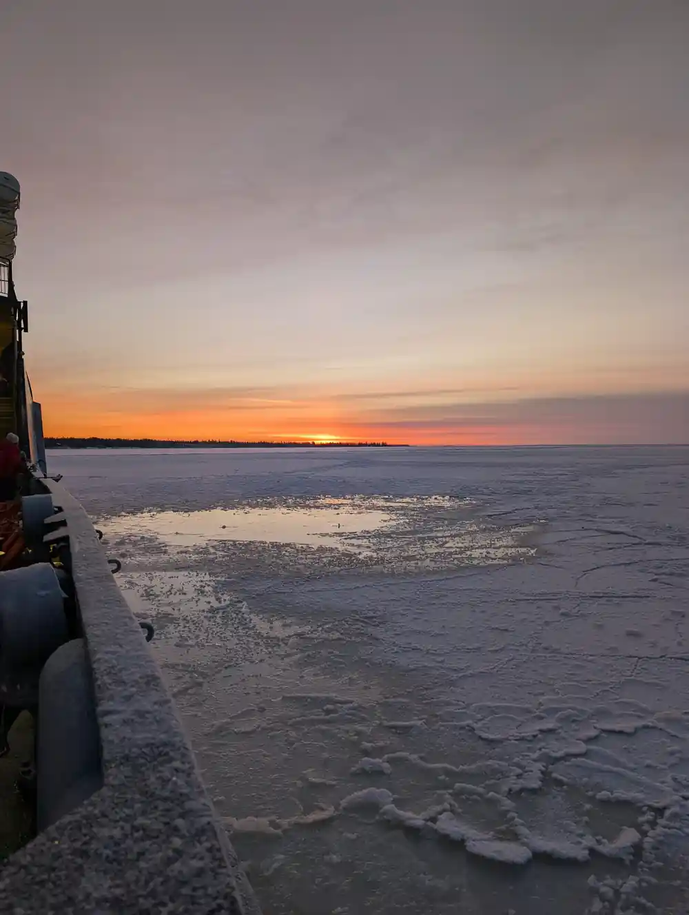 Sunset over pancake ice from the ship deck